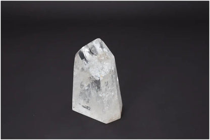 Lemurian Quartz Obelisk with unique properties for energy healing, chakra alignment, and zodiac support on a dark background.