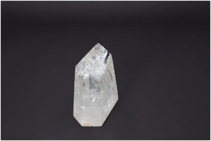 Lemurian Quartz Obelisk with unique energetic properties on a dark background, ideal for spiritual and chakra healing.