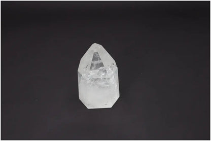 Lemurian Quartz Obelisk on black background, highlighting its unique spiritual energy and chakra alignment properties.