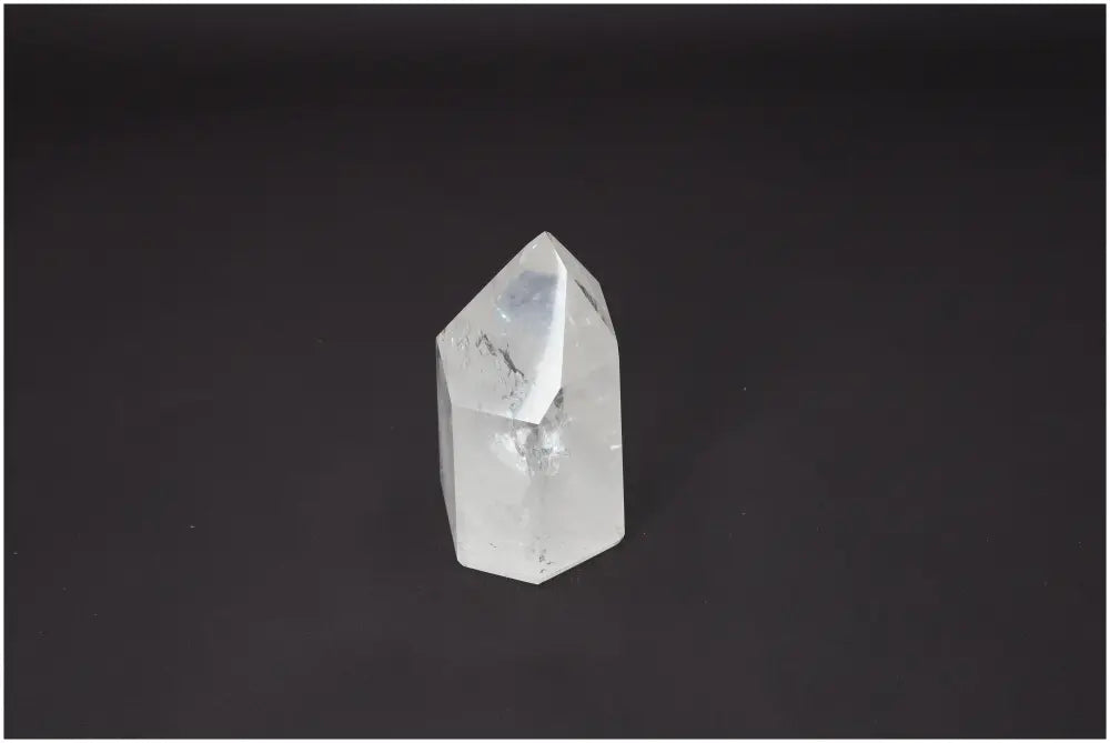 Lemurian Quartz Obelisk on a black background showing its unique crystal clarity and spiritual properties.