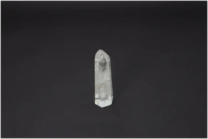 Lemurian Quartz Obelisk against black background, ideal for chakra alignment and zodiac energy balance, enhancing spiritual wellness.