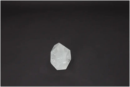 Lemurian Quartz Obelisk on dark background, enhancing chakras and zodiac energies.