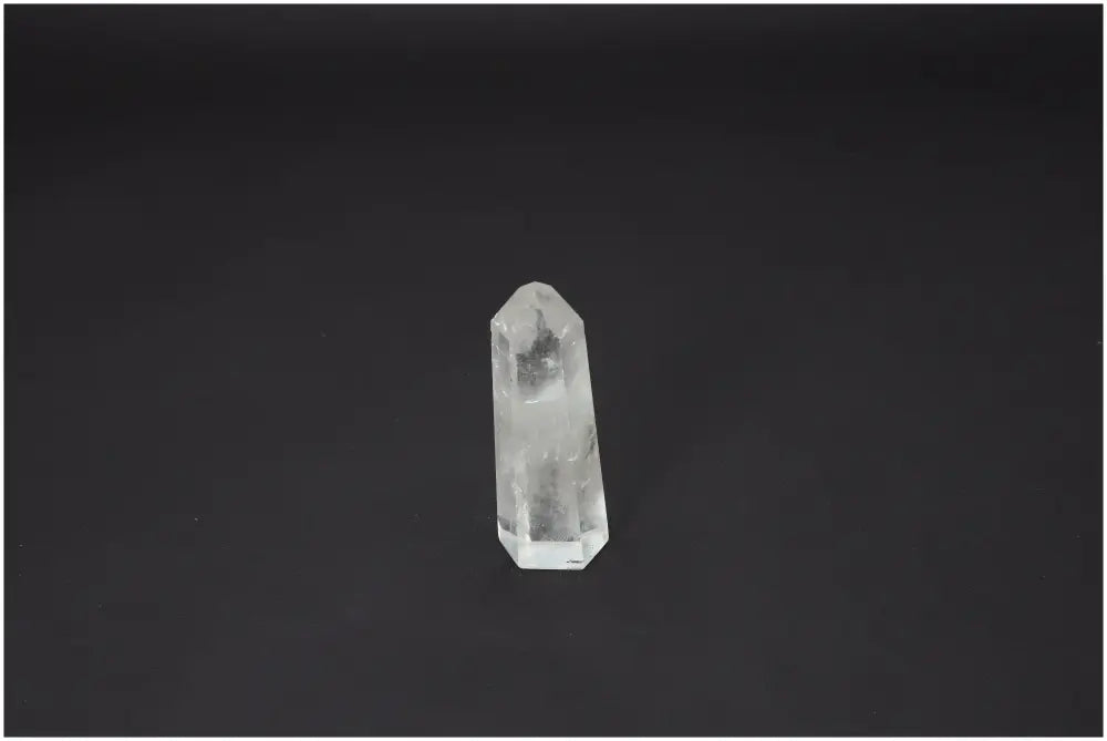 Lemurian Quartz Obelisk on black background, showcasing unique energetic properties linked to chakras and zodiac signs.