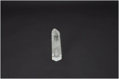 Lemurian Quartz Obelisk for chakra and zodiac energy alignment on dark background