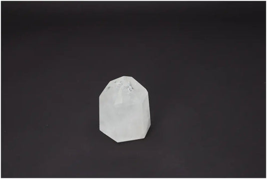 Lemurian Quartz obelisk on dark background, highlighting its unique spiritual and energetic properties for chakras and zodiac signs.