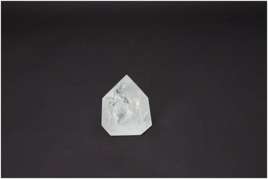 Lemurian Quartz Obelisk crystal on a dark background, showcasing its unique properties for chakra and zodiac energy alignment.