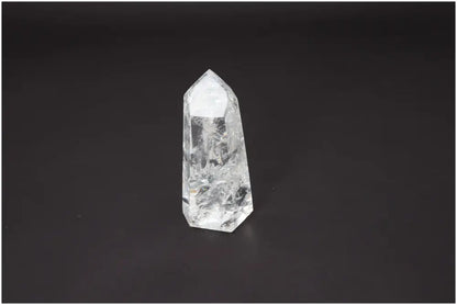 Lemurian Quartz Obelisk for chakra alignment and spiritual enhancement on dark background