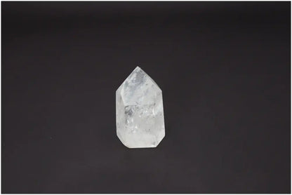 Lemurian Quartz Obelisk for chakra alignment and spiritual energy work against a black background.