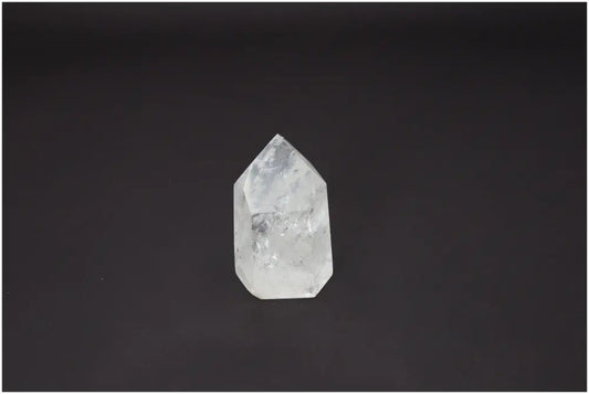 Lemurian Quartz Obelisk for chakra alignment and spiritual energy work against a black background.