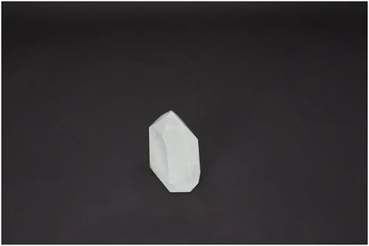 Lemurian Quartz Obelisk on dark background, highlighting its natural energy and spiritual benefits for chakras and zodiac signs.
