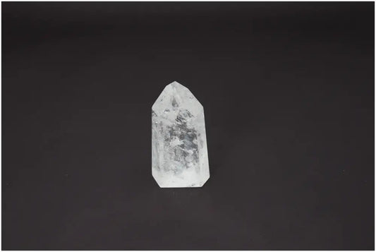 Lemurian Quartz Obelisk on a dark background, promoting chakra healing and enhancing spiritual energy.