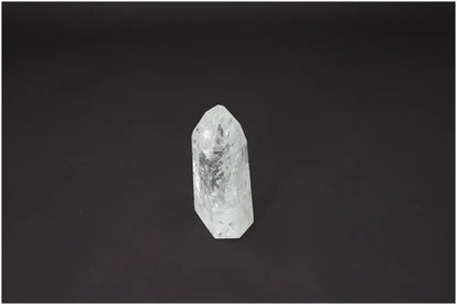 Lemurian Quartz Obelisk on black background, enhancing energetic and spiritual needs through unique properties and characteristics. 