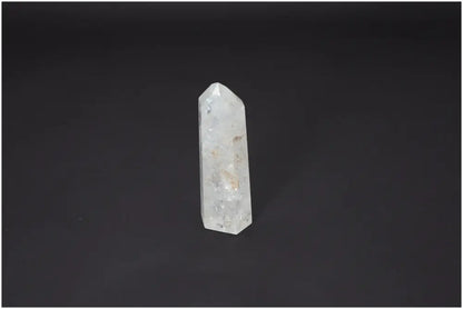 Lemurian Quartz Obelisk on black background with spiritual and chakra balancing properties.