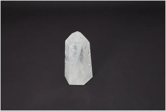 Lemurian Quartz Obelisk on a dark background, showcasing its unique properties for chakra alignment and spiritual enhancement.