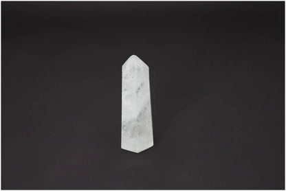 Lemurian Quartz Obelisk on black background, showcasing its unique properties and supporting spiritual and energetic needs.
