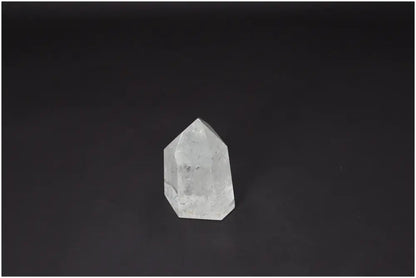 Lemurian Quartz Obelisk on dark background showcasing spiritual and energetic properties with chakra and zodiac connections.