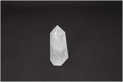 Lemurian Quartz Obelisk on a dark background, showcasing unique properties and connection to chakras and zodiac signs.