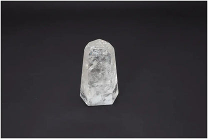Lemurian Quartz Obelisk against dark background, showcasing clarity and spiritual energy benefits for chakra and zodiac healing.