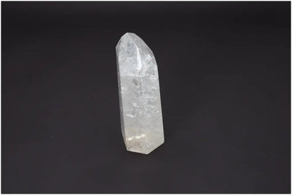 Lemurian Quartz Obelisk on black background, showcasing crystal features and transparency ideal for chakra and zodiac energy alignment.