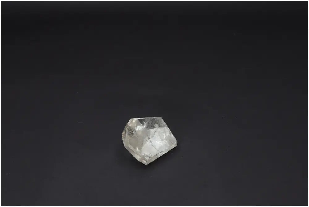 Lemurian Quartz Obelisk on black background, promoting chakra and zodiac energies with unique quartz properties.