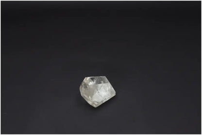 Lemurian Quartz Obelisk on black background, promoting chakra and zodiac energies with unique quartz properties.