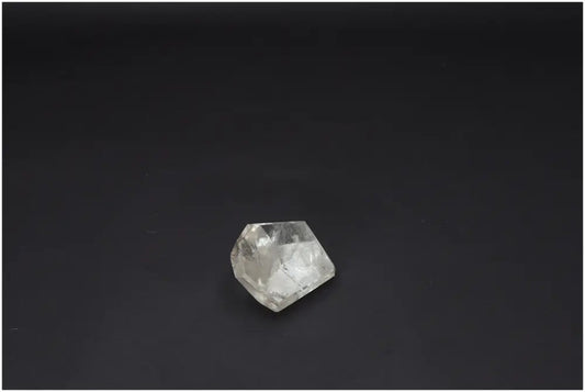 Lemurian Quartz Obelisk on black background, promoting chakra and zodiac energies with unique quartz properties.