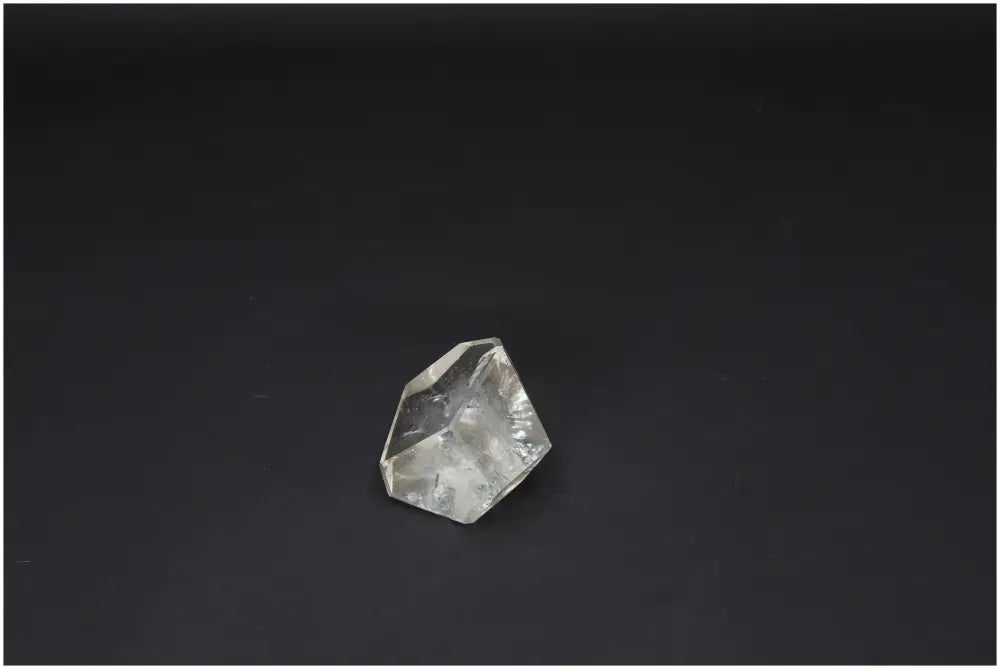 Lemurian Quartz Obelisk on black background, associated with chakras and zodiac, enhances energetic and spiritual well-being.
