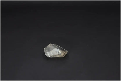 Lemurian Quartz Obelisk against a dark background, showcasing clarity and spiritual properties connected to chakras and zodiac signs.