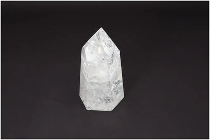 Lemurian Quartz Obelisk on black background showcasing its clear crystalline structure for chakra and zodiac energy alignment.
