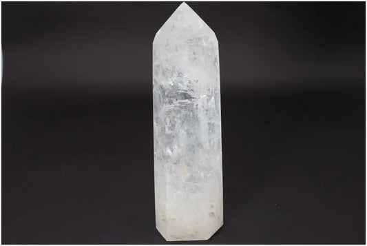 Lemurian Quartz Obelisk on black background, known for clarity and energy amplification, ethically sourced and naturally formed.