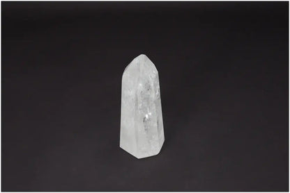 Lemurian Quartz Obelisk against dark background, known as "Master Healer", promotes clarity, balance, and personal growth.