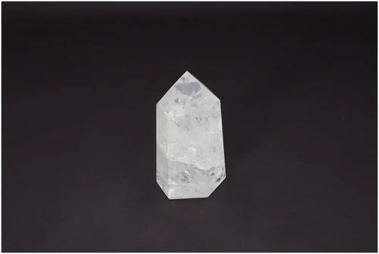 Lemurian Quartz Obelisk, ethically sourced clear quartz for clarity, balance, and personal growth, on a dark background.