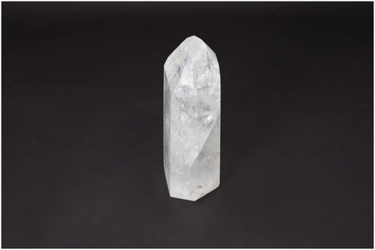 Lemurian Quartz Obelisk on dark background, known as the 'Master Healer' crystal, symbolizing clarity and balance.