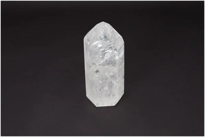 Lemurian Quartz Obelisk on dark background, known as Master Healer crystal, enhances clarity, balance, and personal growth.