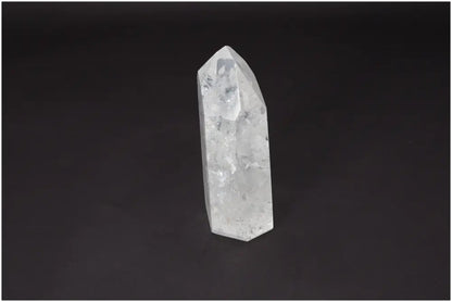 Clear Lemurian Quartz Obelisk crystal for clarity, balance, and personal growth on a dark background.
