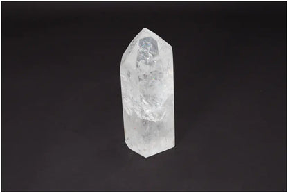 Lemurian Quartz Obelisk on black background, showcasing its crystal clarity and natural formation. Ideal for energy amplification.