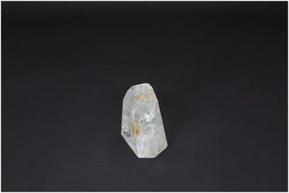 Lemurian Quartz Obelisk on a dark background, showcasing its clarity and natural form, ideal for energy amplification and personal growth.