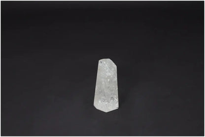 Lemurian Quartz Obelisk on black background, a hand-selected clear crystal for clarity, balance, and personal growth.