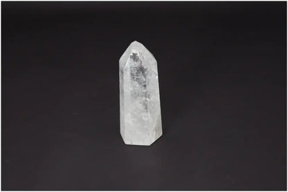 Lemurian Quartz Obelisk on dark background, showcasing clear quartz crystal for clarity and balance in personal growth.