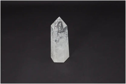 Lemurian Quartz Obelisk on dark background, known for clarity, balance, and healing energy.