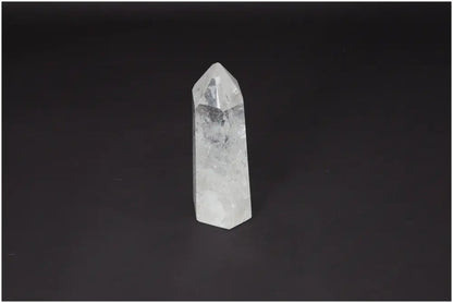 Lemurian Quartz Obelisk - Clear Quartz crystal with healing properties on a dark background, ethically sourced and naturally formed.
