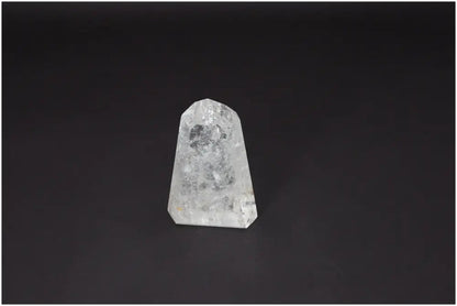 Lemurian Quartz Obelisk against black background, enhances clarity and balance, ethically sourced, master healer crystal.