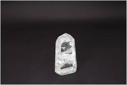 Lemurian Quartz Obelisk crystal on a dark background, known for clarity and healing, hand-selected and ethically sourced.