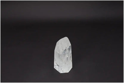 Lemurian Quartz Obelisk on dark background, amplifying clarity and balance. Ethically sourced, naturally formed crystal.