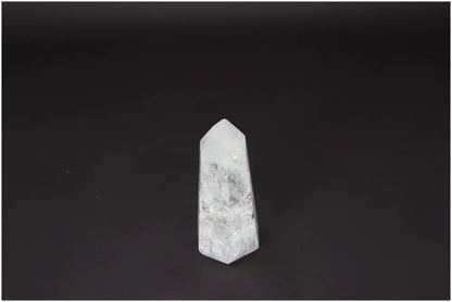 Lemurian Quartz Obelisk on a dark background, symbolizing clarity and personal growth. Ethically sourced and naturally formed crystal.