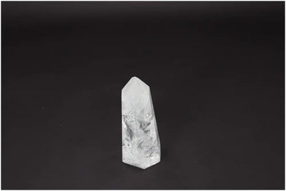 Lemurian Quartz Obelisk crystal on black background, known for enhancing clarity and balance, used in personal growth and energy healing.