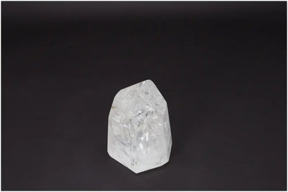 Lemurian Quartz Obelisk on black background, symbolizing clarity and balance. Ethically sourced, natural Clear Quartz crystal.