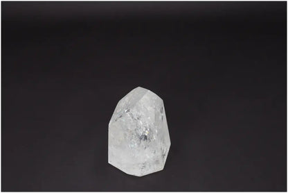 Lemurian Quartz Obelisk on dark background, highlighting its clarity and natural formation, ideal for energy amplification and healing.