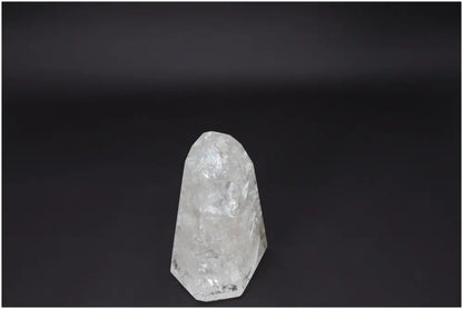 Lemurian Quartz Obelisk for clarity and balance, ethically sourced clear quartz crystal on a black background, perfect for personal growth.