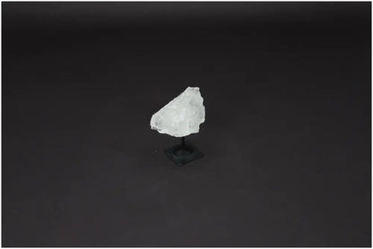 Lemurian Clear Quartz crystal on a metal stand, known for enhancing clarity, balance, and personal growth through its healing energy.